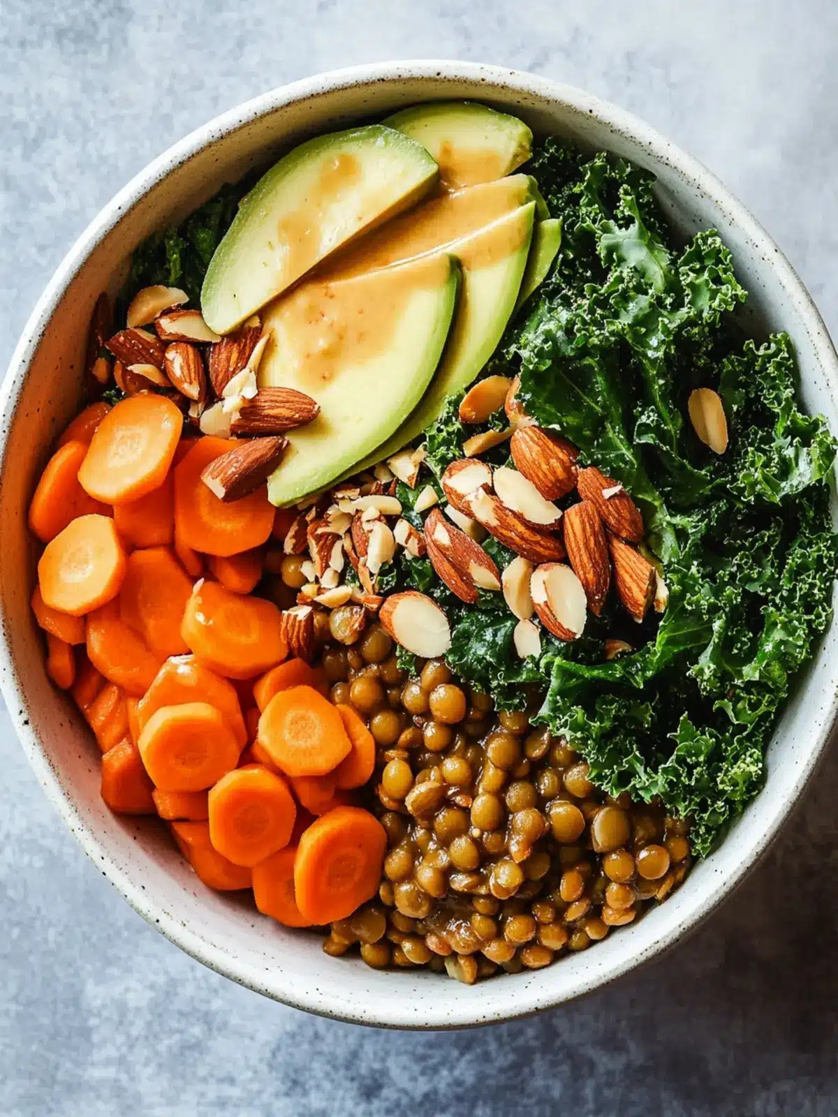 Nourishing Kale and Lentil Bowl with Pickled Carrots and Thai Almond Sauce